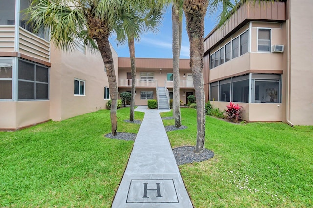 373 Piedmont H, Delray Beach, FL 33484 - view of home's community with a lawn