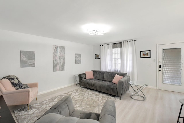 373 Piedmont H, Delray Beach, FL 33484 - living room featuring baseboards and wood finished floors