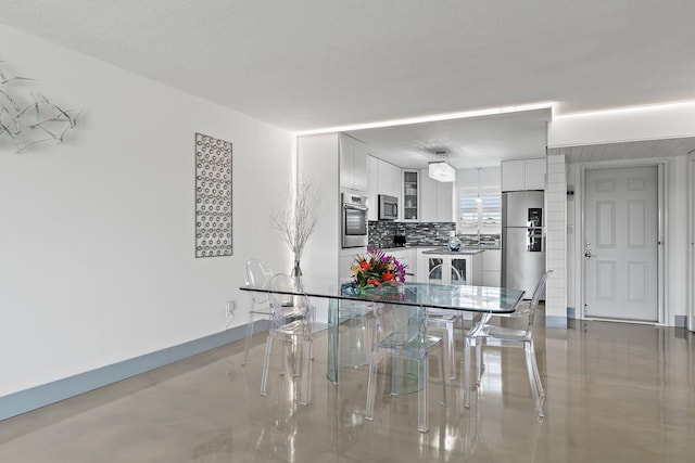 dining room featuring baseboards