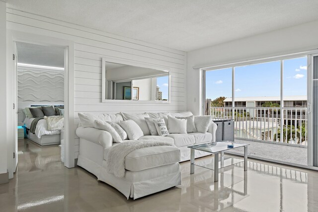 living area with concrete flooring