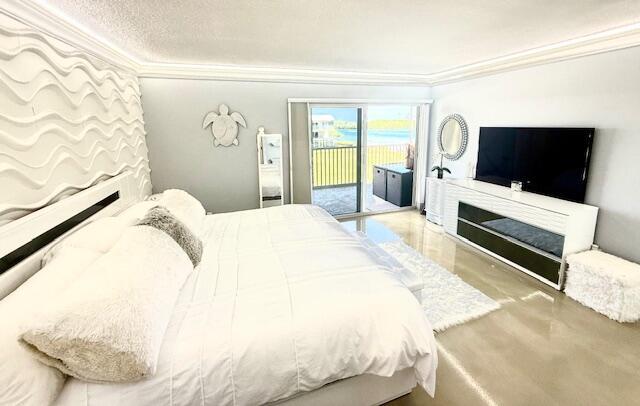 bedroom featuring access to exterior and crown molding
