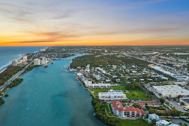 aerial view featuring a view of city and a water view