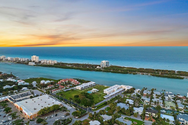 aerial view at dusk with a water view