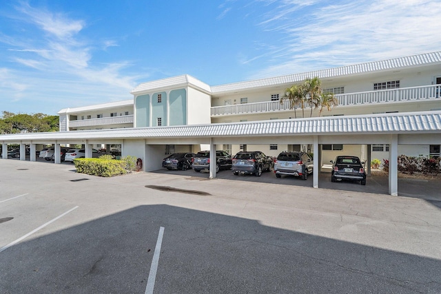view of partially covered parking lot