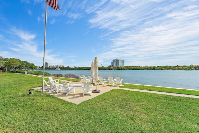 exterior space with a water view and a patio area