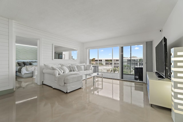 living room featuring concrete flooring
