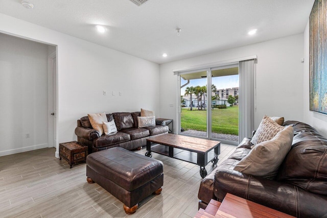 7113 Peters Ln, Delray Beach, FL 33446 - living room featuring baseboards, recessed lighting, and light wood-type flooring