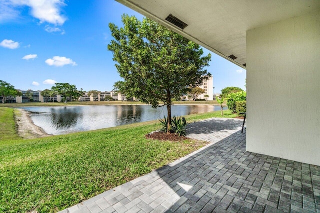7113 Peters Ln, Delray Beach, FL 33446 - view of patio featuring a water view