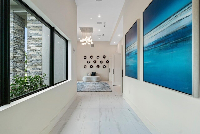 7113 Peters Ln, Delray Beach, FL 33446 - hall featuring baseboards and a chandelier