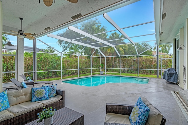 outdoor pool with a patio, an outdoor living space, a lanai, and a ceiling fan