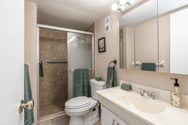 230 NE 26th Ave Unit 1030, Boynton Beach, FL 33435 - bathroom featuring toilet, vanity, a stall shower, and visible vents