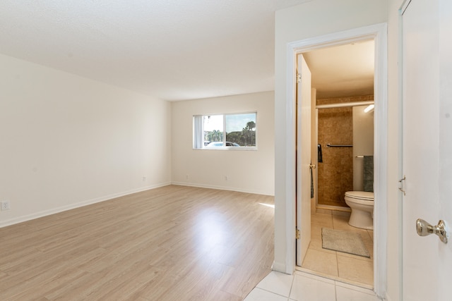 230 NE 26th Ave Unit 1030, Boynton Beach, FL 33435 - full bath with baseboards, toilet, a shower stall, and wood finished floors