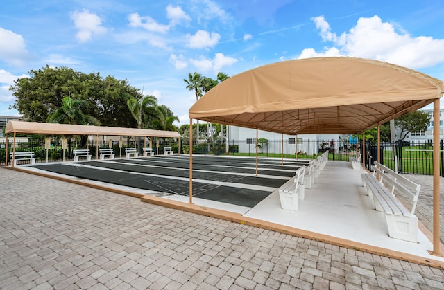 230 NE 26th Ave Unit 1030, Boynton Beach, FL 33435 - view of property's community featuring shuffleboard and fence