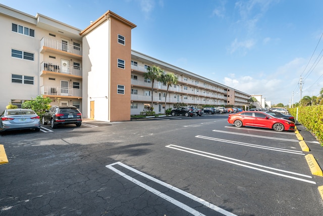 230 NE 26th Ave Unit 1030, Boynton Beach, FL 33435 - view of building exterior featuring uncovered parking