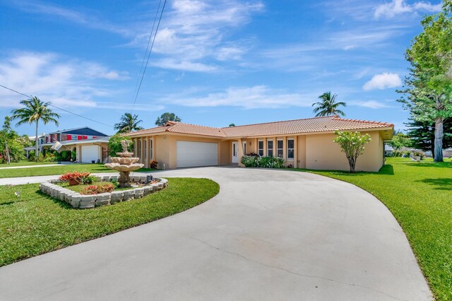 1746 W Terrace Dr, Lake Worth, FL 33460 - ranch-style house featuring stucco siding, a front yard, a garage, and a tiled roof