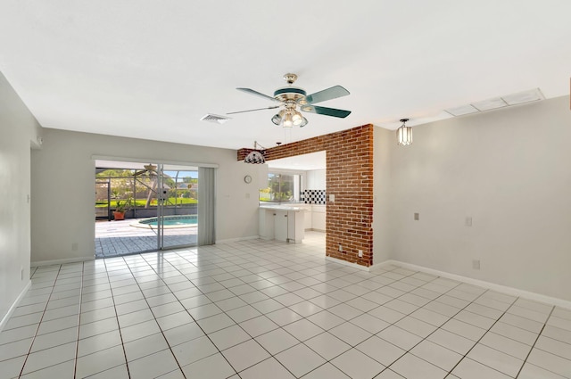 1746 W Terrace Dr, Lake Worth, FL 33460 - empty room featuring a ceiling fan, baseboards, and light tile patterned floors