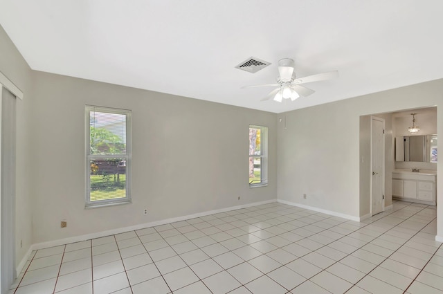 1746 W Terrace Dr, Lake Worth, FL 33460 - empty room featuring ceiling fan, baseboards, and light tile patterned floors
