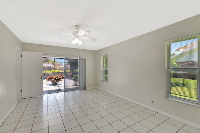 1746 W Terrace Dr, Lake Worth, FL 33460 - unfurnished room featuring a ceiling fan, baseboards, and light tile patterned flooring