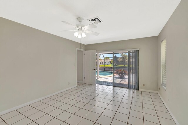1746 W Terrace Dr, Lake Worth, FL 33460 - empty room featuring a ceiling fan, baseboards, and light tile patterned flooring