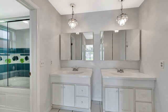 1746 W Terrace Dr, Lake Worth, FL 33460 - bathroom with two vanities, a chandelier, and bath / shower combo with glass door