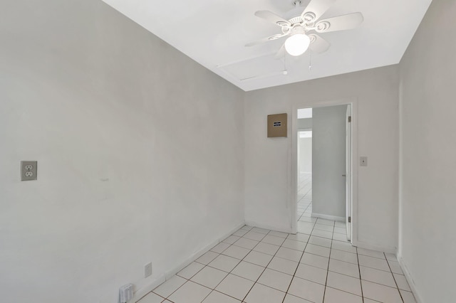 1746 W Terrace Dr, Lake Worth, FL 33460 - empty room with a ceiling fan, light tile patterned floors, and baseboards