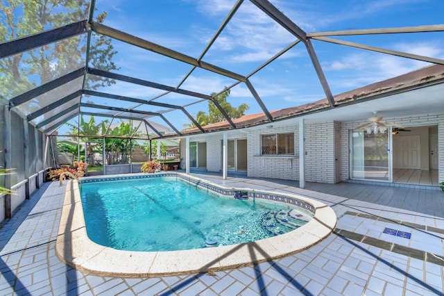 1746 W Terrace Dr, Lake Worth, FL 33460 - swimming pool featuring a ceiling fan, a patio area, and glass enclosure