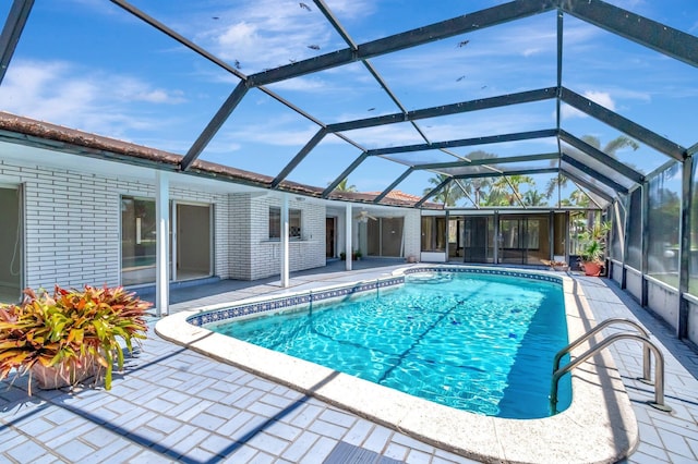 1746 W Terrace Dr, Lake Worth, FL 33460 - swimming pool with a patio and glass enclosure