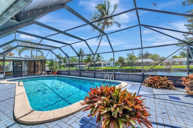 1746 W Terrace Dr, Lake Worth, FL 33460 - swimming pool with a patio area, a water view, and a lanai