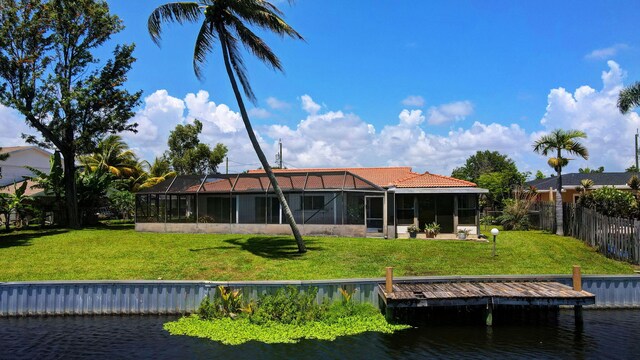 1746 W Terrace Dr, Lake Worth, FL 33460 - rear view of house featuring a water view and a tile roof
