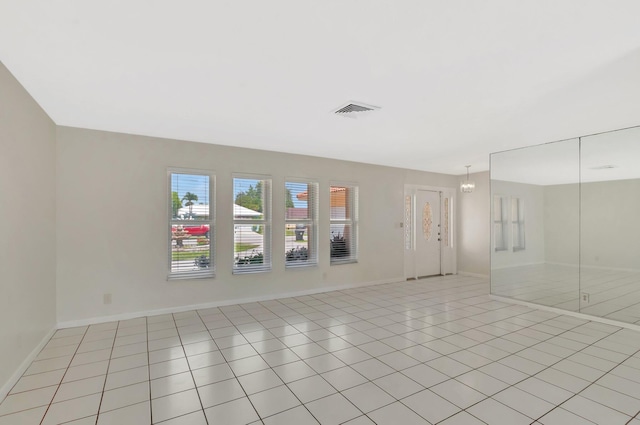 1746 W Terrace Dr, Lake Worth, FL 33460 - empty room with baseboards and light tile patterned flooring