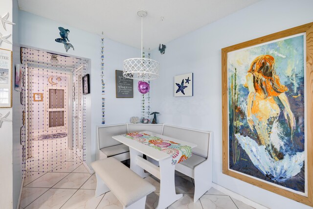 dining room with marble finish floor