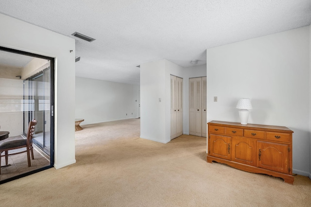 2050 Oleander Blvd Unit 3-206, Fort Pierce, FL 34950 - spare room featuring light colored carpet and baseboards