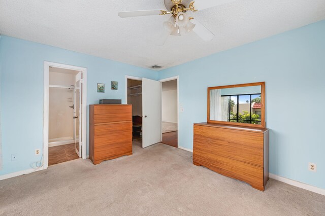 2050 Oleander Blvd Unit 3-206, Fort Pierce, FL 34950 - bedroom with carpet flooring, a spacious closet, connected bathroom, baseboards, and a closet