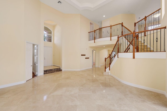 9682 Campi Dr, Lake Worth, FL 33467 - foyer entrance featuring baseboards, stairway, and arched walkways