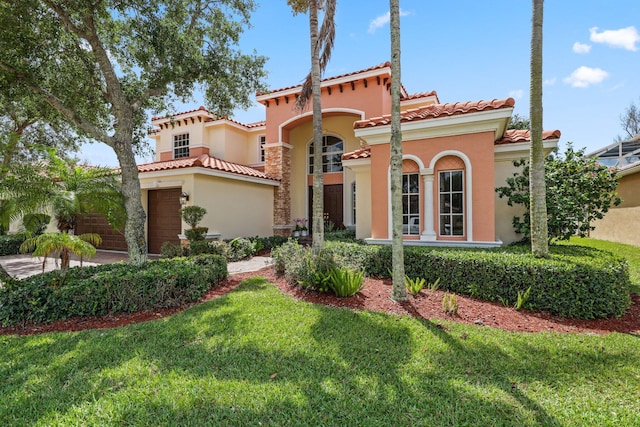9682 Campi Dr, Lake Worth, FL 33467 - mediterranean / spanish-style house with a front yard, stucco siding, and a tile roof