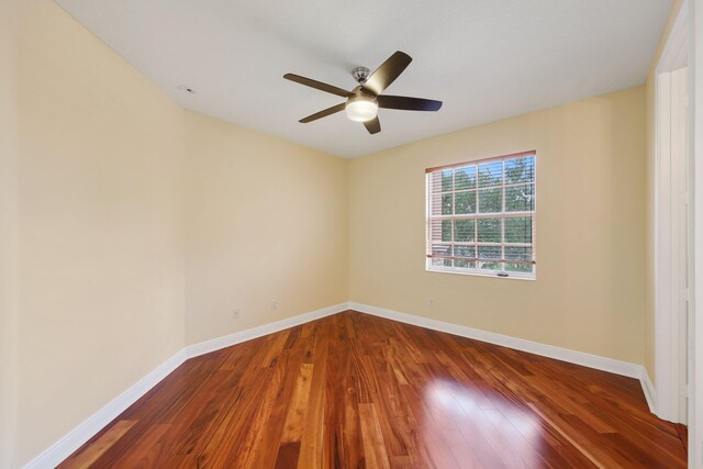 9682 Campi Dr, Lake Worth, FL 33467 - empty room with baseboards, a ceiling fan, and wood finished floors