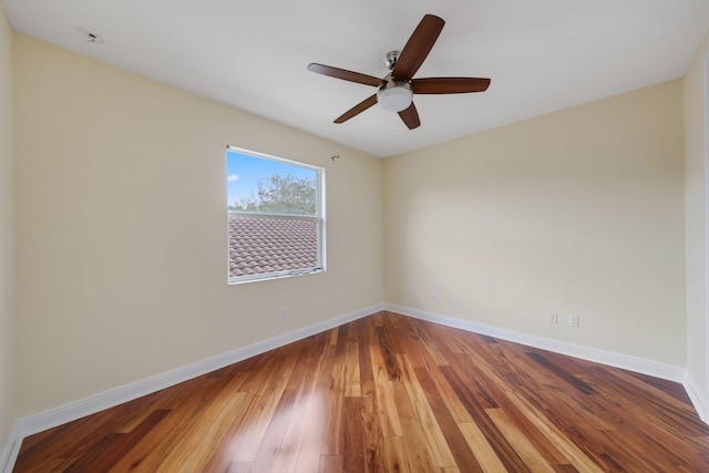 9682 Campi Dr, Lake Worth, FL 33467 - empty room with ceiling fan, wood finished floors, and baseboards