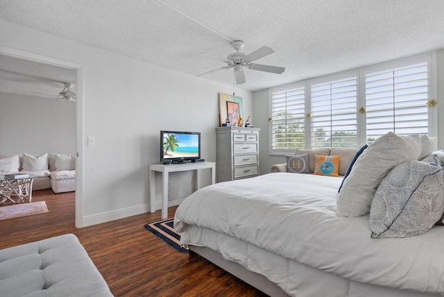 2809 Florida Blvd Unit 307, Delray Beach, FL 33483 - bedroom featuring ceiling fan, a textured ceiling, baseboards, and wood finished floors