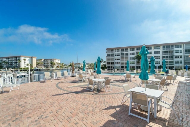2809 Florida Blvd Unit 307, Delray Beach, FL 33483 - view of patio featuring a water view and a community pool