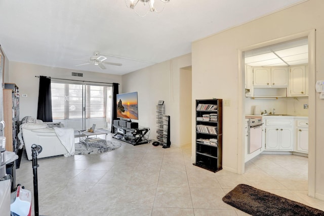 1021 Crystal Lake Dr Unit 109, Deerfield Beach, FL 33064 - exercise room with light tile patterned flooring, a sink, and ceiling fan