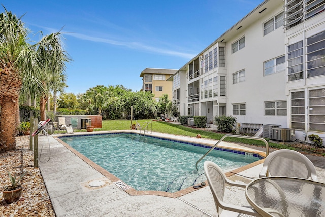 1021 Crystal Lake Dr Unit 109, Deerfield Beach, FL 33064 - pool featuring a patio and cooling unit