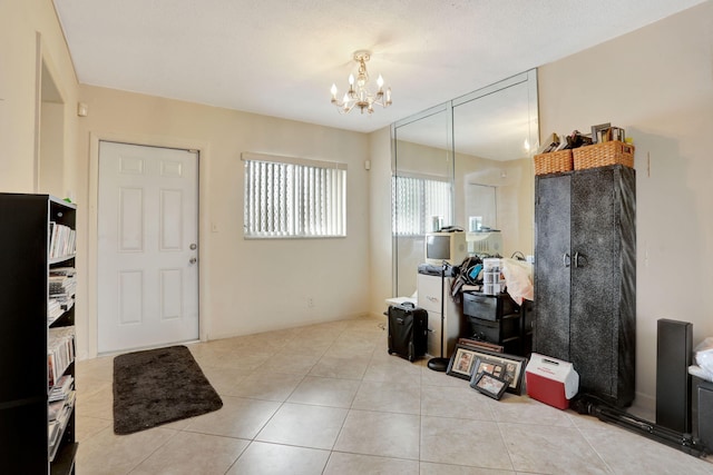 1021 Crystal Lake Dr Unit 109, Deerfield Beach, FL 33064 - foyer entrance with light tile patterned floors and a chandelier