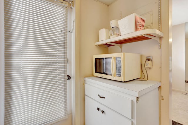 1021 Crystal Lake Dr Unit 109, Deerfield Beach, FL 33064 - room details with white microwave