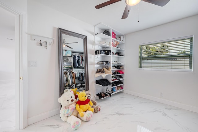 180 NW 18th St, Pompano Beach, FL 33060 - interior space with a closet, baseboards, a ceiling fan, and marble finish floor