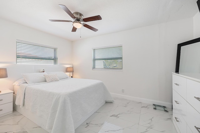 180 NW 18th St, Pompano Beach, FL 33060 - bedroom with baseboards, a ceiling fan, marble finish floor, and a textured ceiling