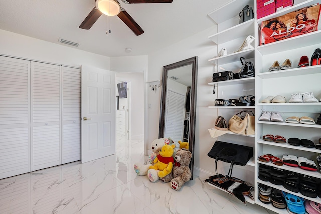 180 NW 18th St, Pompano Beach, FL 33060 - walk in closet featuring marble finish floor, a ceiling fan, and visible vents