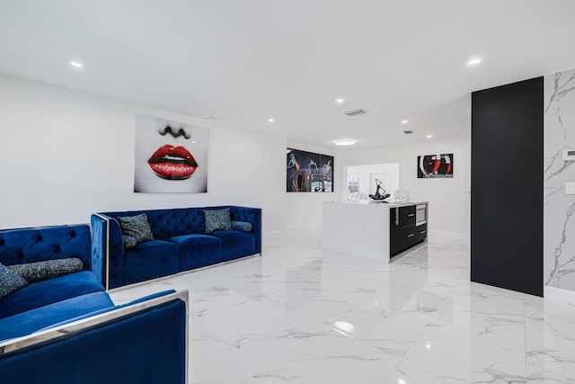 180 NW 18th St, Pompano Beach, FL 33060 - living room with visible vents, recessed lighting, and marble finish floor