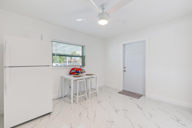 180 NW 18th St, Pompano Beach, FL 33060 - interior space with baseboards, a ceiling fan, and marble finish floor