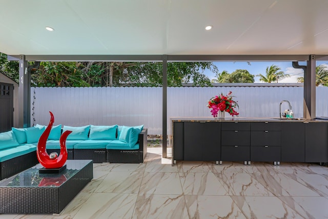 180 NW 18th St, Pompano Beach, FL 33060 - view of patio with a sink, a fenced backyard, and an outdoor living space