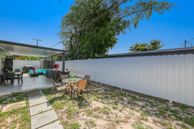 180 NW 18th St, Pompano Beach, FL 33060 - view of yard with a fenced backyard, outdoor lounge area, and a patio